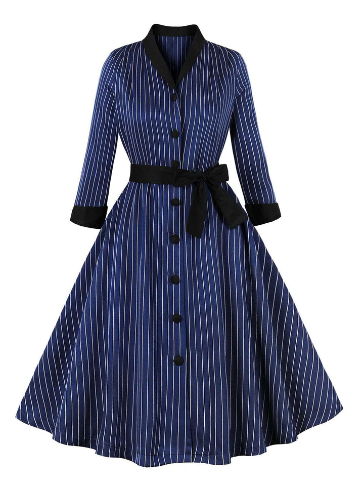 She slips into this Dark Blue 1950s Striped Patchwork Belted Dress and suddenly it&
