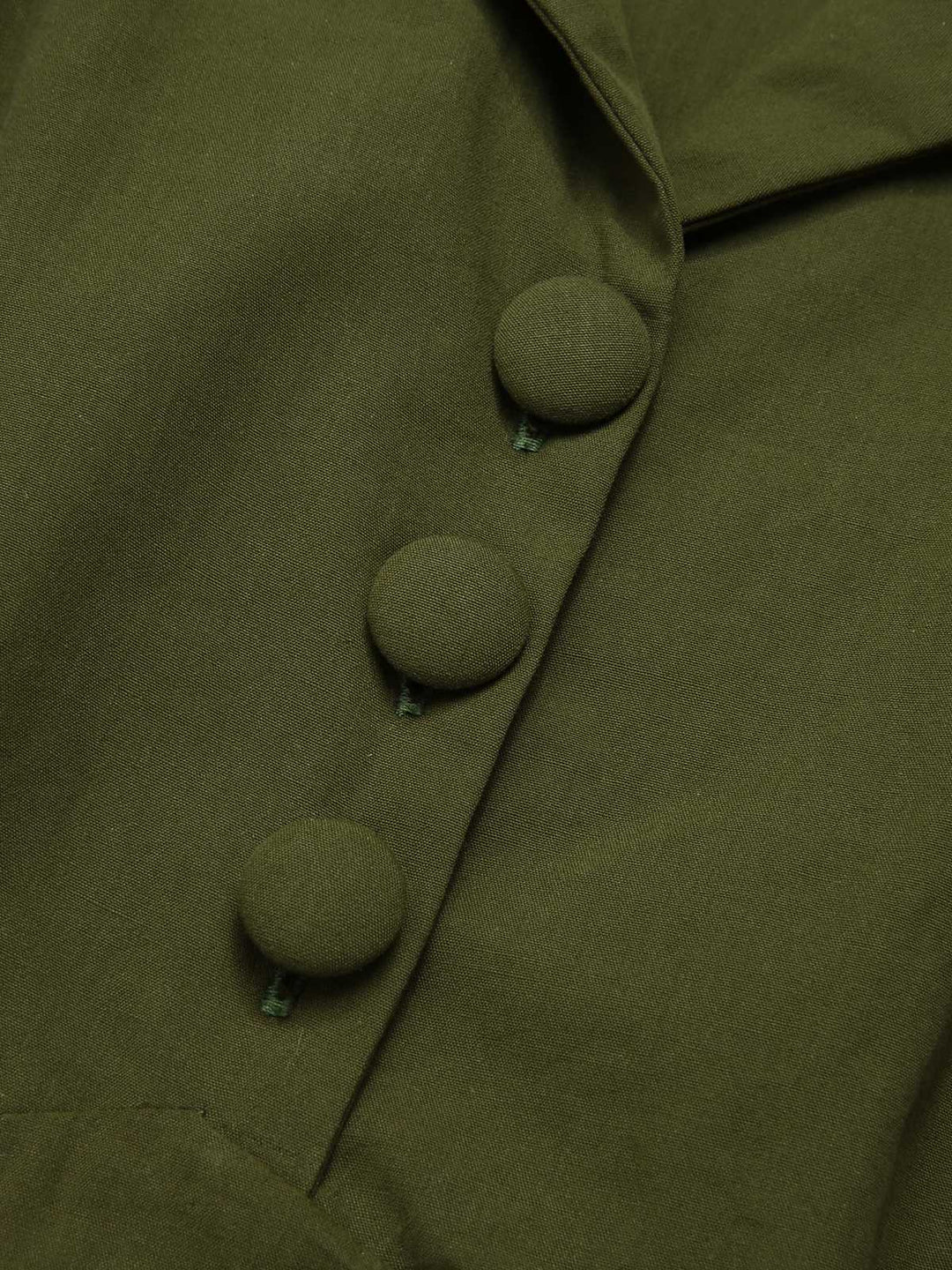 She slips into this Green 1940s Lapel Buttoned Solid Dress and suddenly it&