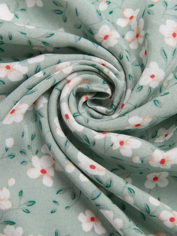 Green 1940s V-Neck Ditsy Floral Irregular Hem Dress — the kind of 1940s dress that makes strangers smile