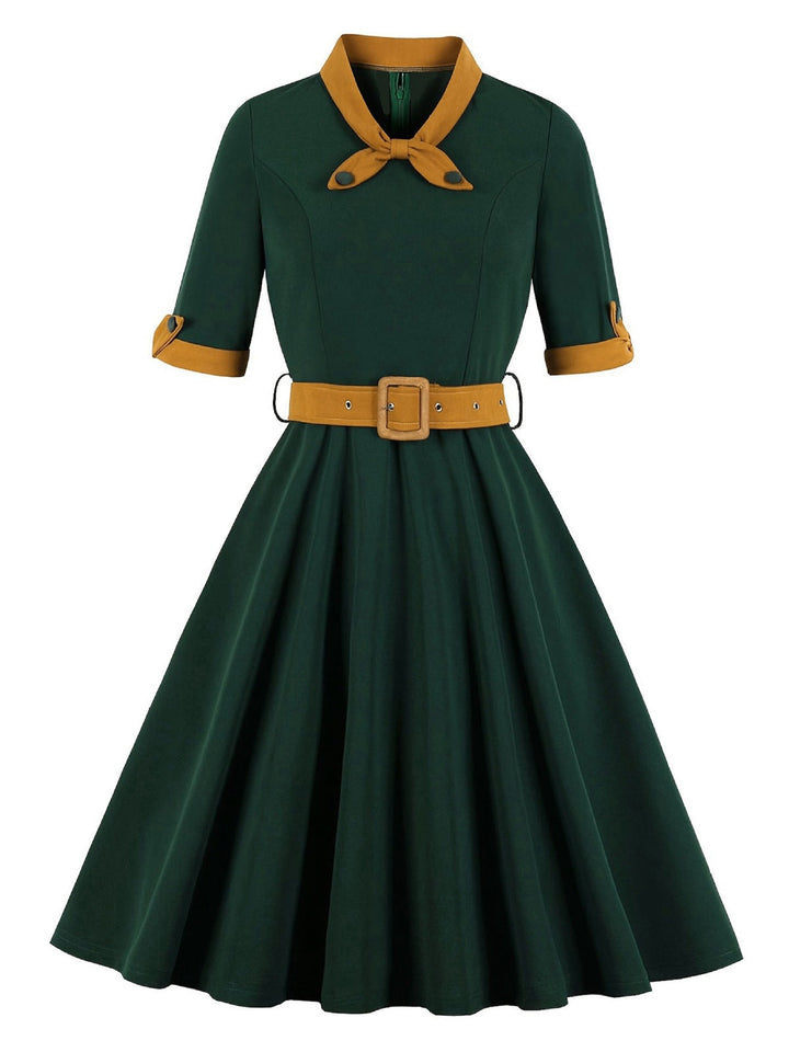She slips into this Green 1950s Tie Neck Contrast Patchwork Dress and suddenly it&