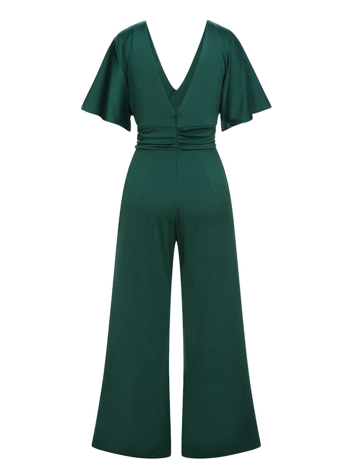 This Green 1960s V-Neck High Waist Wide-Leg Jumpsuit whispers 1960s secrets to those who notice