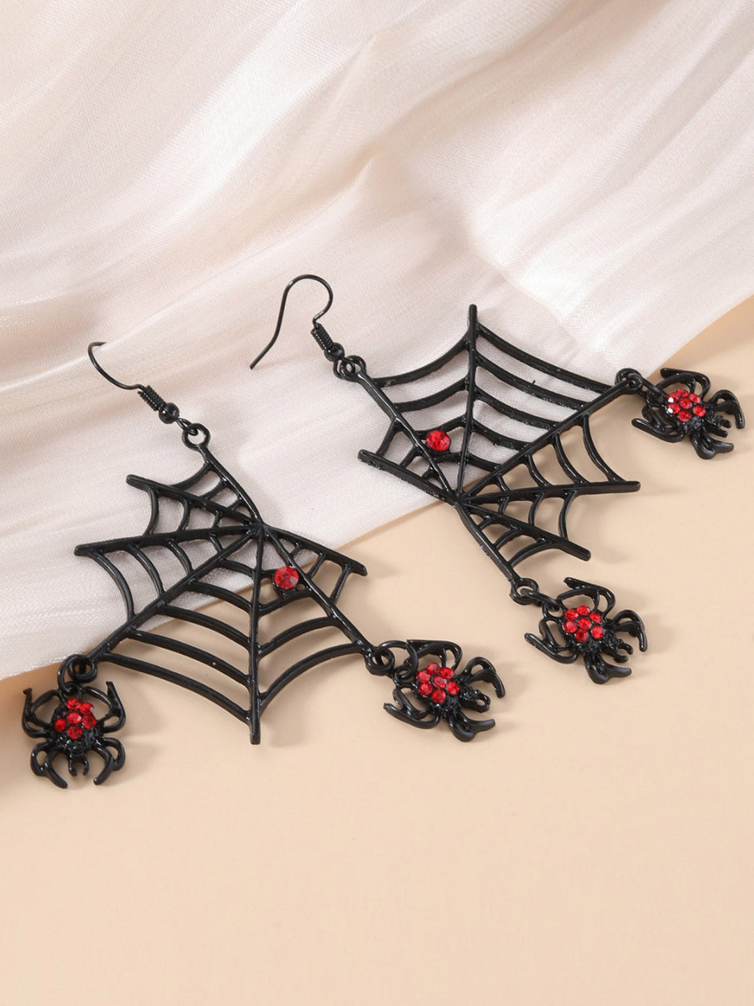 She adds this Halloween Black Spider Web Earrings and suddenly it&