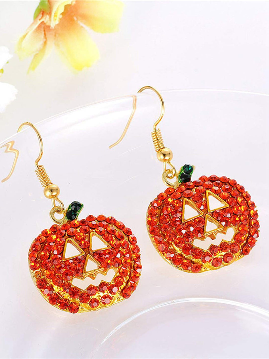 She adds this Halloween Rhinestones Grimace Pumpkin Earrings and suddenly it&