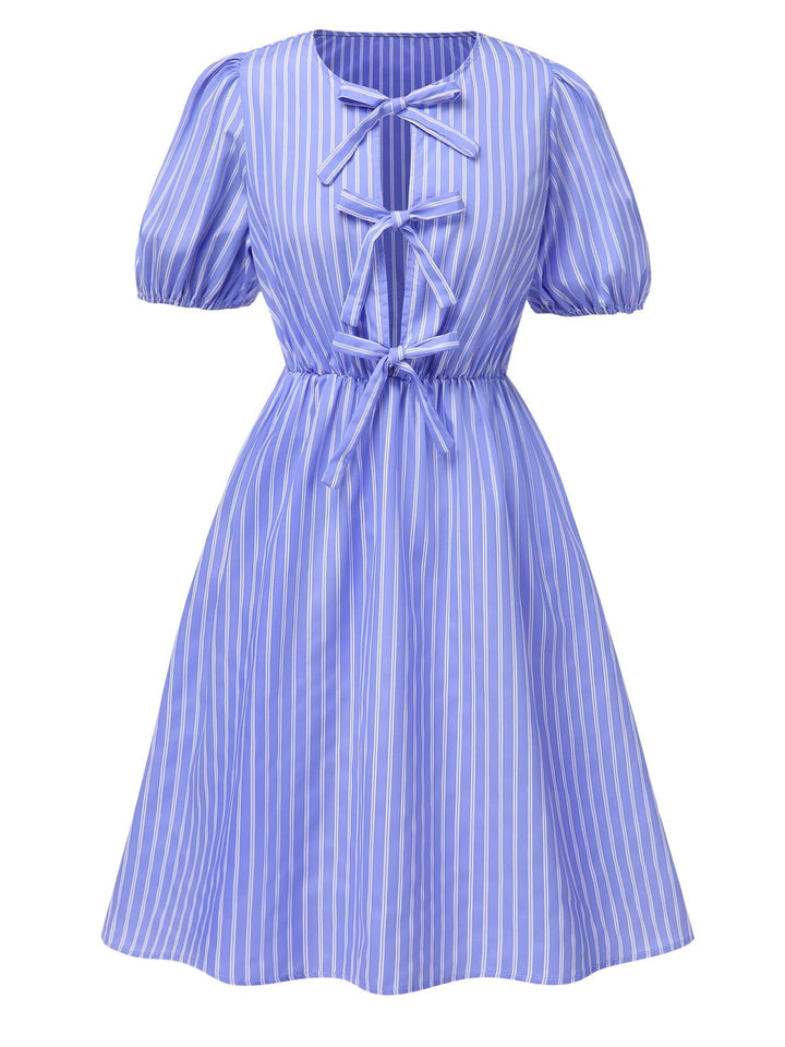 She slips into this Light Blue 1950s Striped Bow Lace-Up Dress and suddenly it&