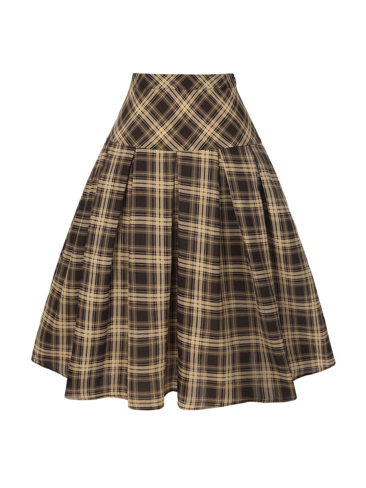 She pairs this 2PCS 1950s Beige Knitted Top &amp; Plaid Pleated Skirt with confidence and 1950s charm