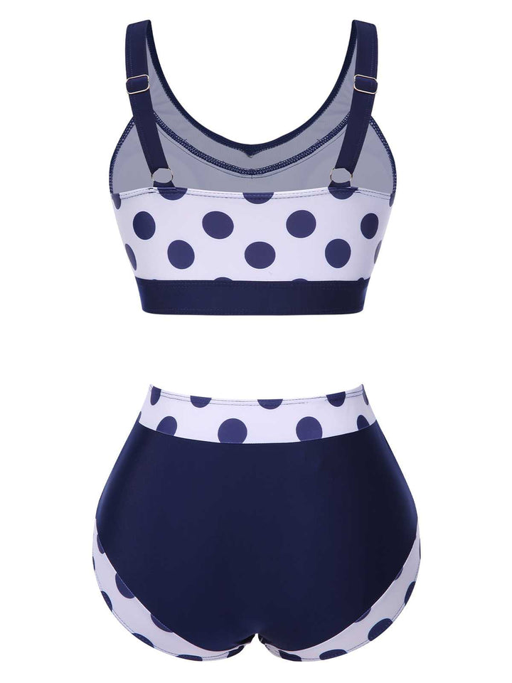 This Navy Blue 1950s Polka Dots High-Waist Swimsuit carries 1950s vacation dreams in every stitch