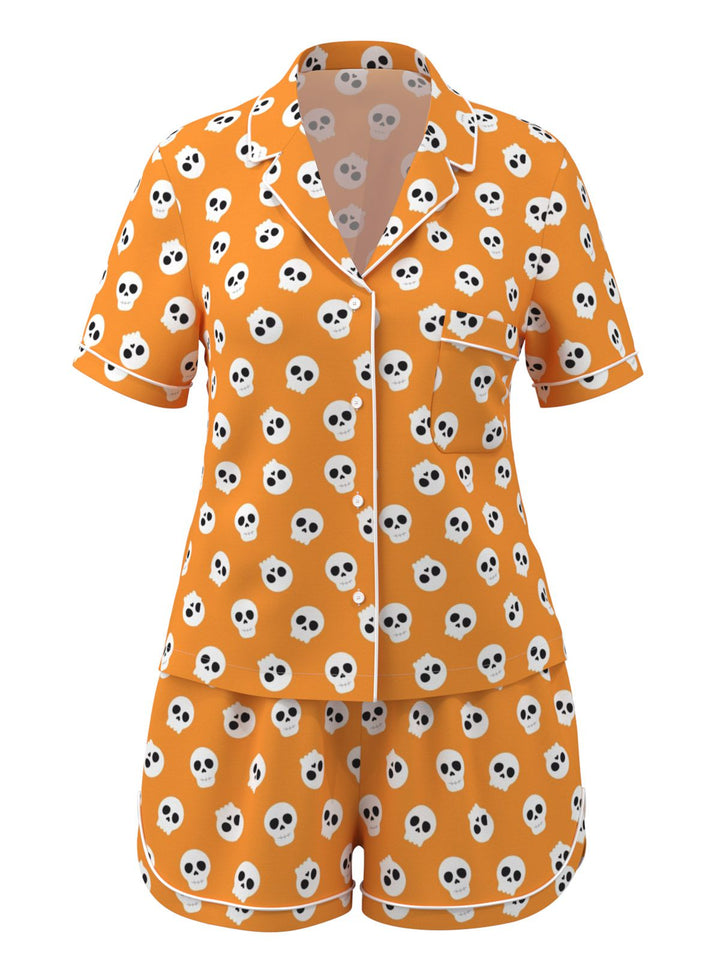 She finds her story in this Orange Halloween Cartoon Skull Pajamas
