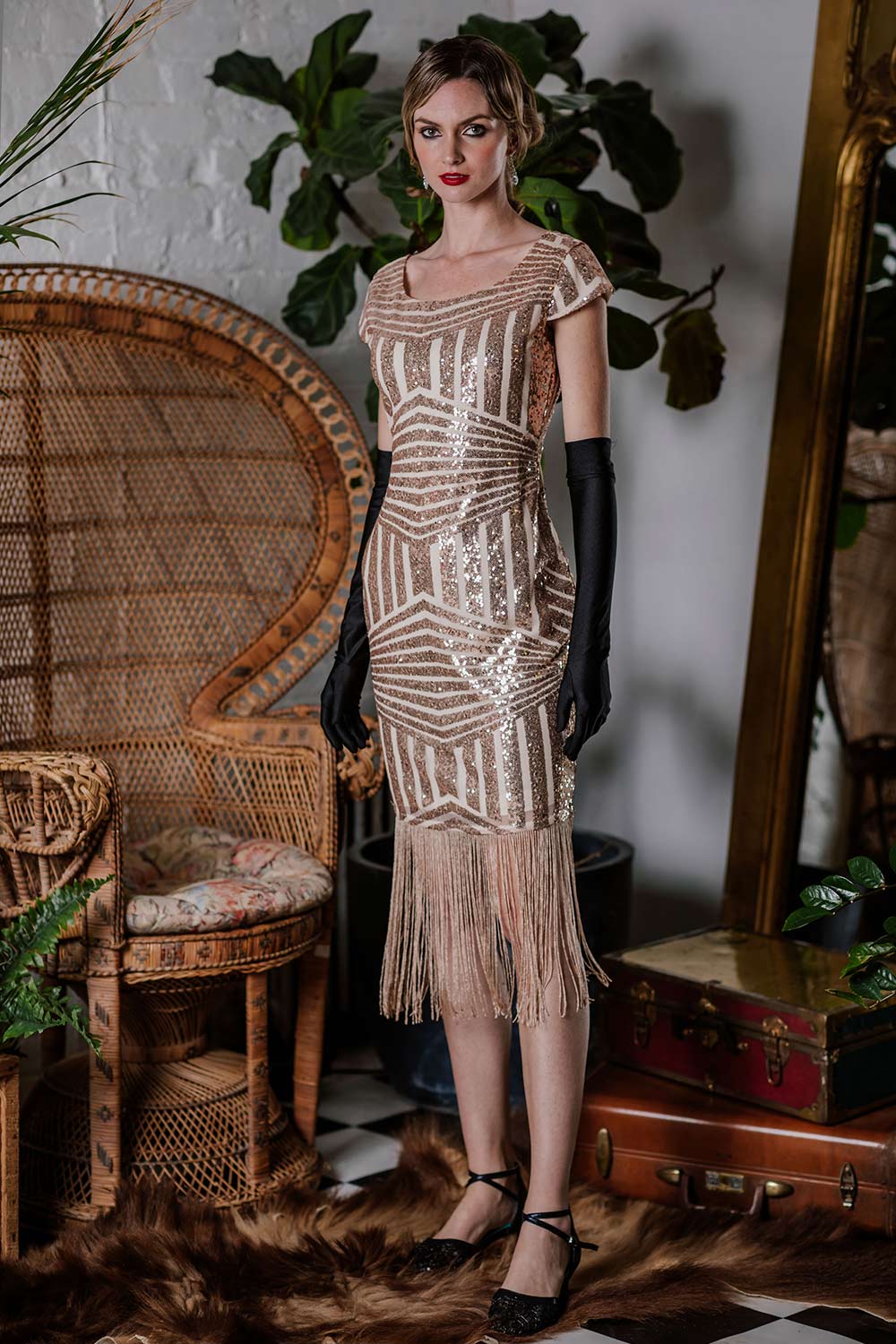 This Pink 1920s Sequin Fringed Dress wraps her in 1920s elegance, one twirl at a time