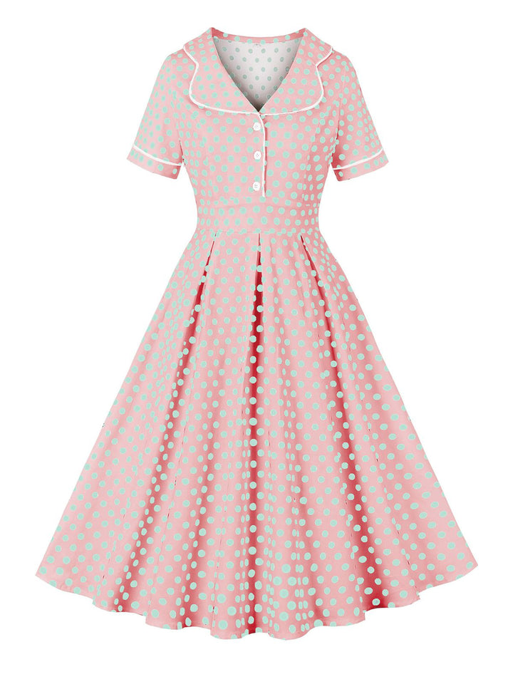She slips into this Pink 1950s Blue Polka Dot Lapel Dress and suddenly it&