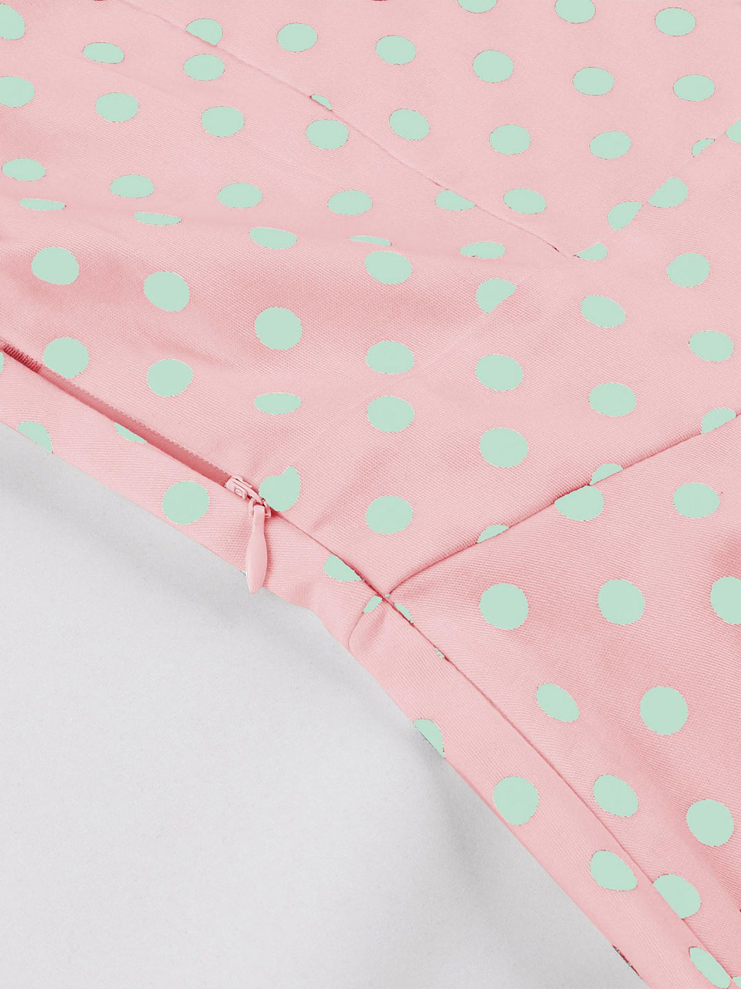 This Pink 1950s Blue Polka Dot Lapel Dress wraps her in 1950s elegance, one twirl at a time