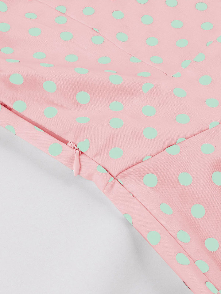 This Pink 1950s Blue Polka Dot Lapel Dress wraps her in 1950s elegance, one twirl at a time