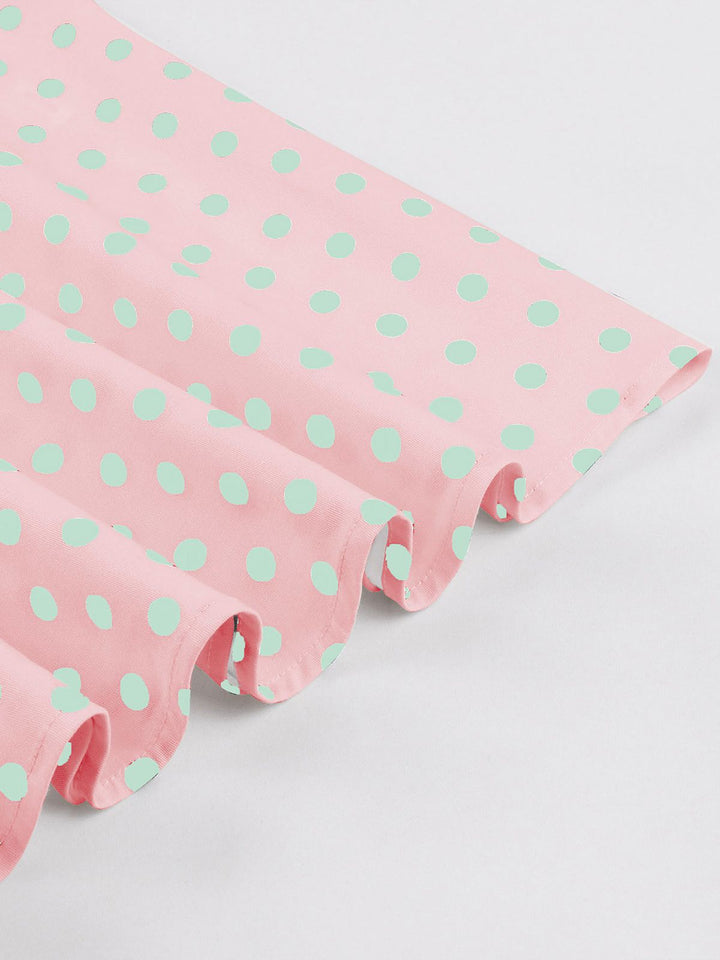 Pink 1950s Blue Polka Dot Lapel Dress — the kind of 1950s dress that makes strangers smile