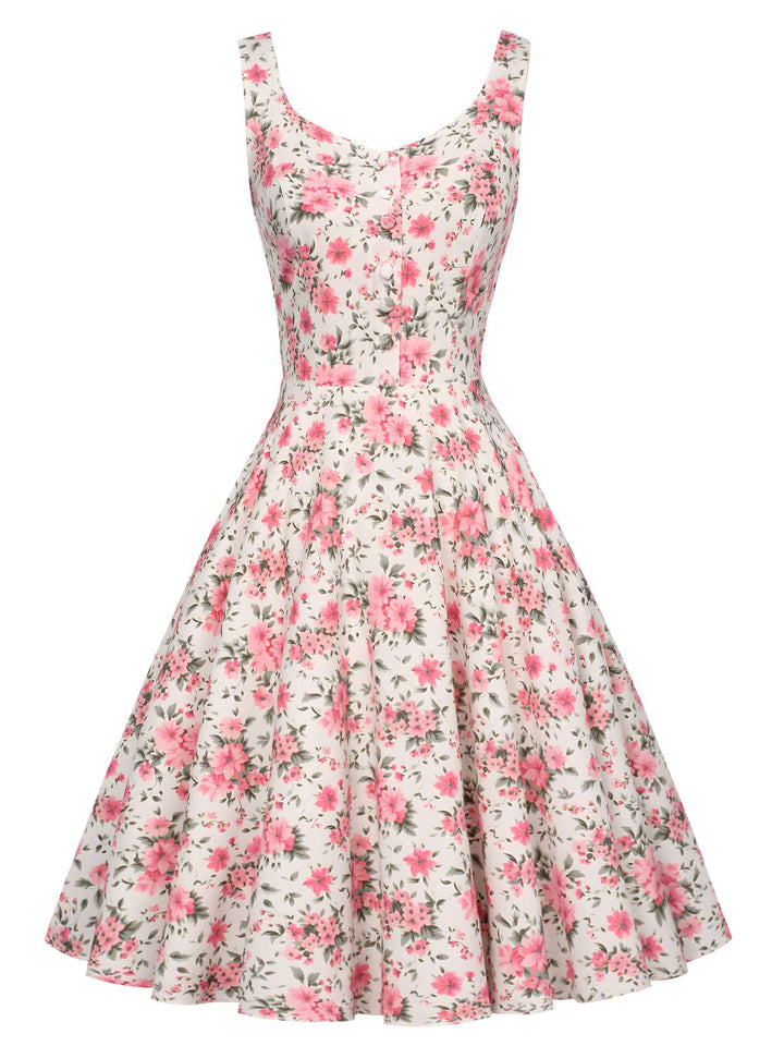 She slips into this Pink 1950s Ditsy Floral Smocked Dress and suddenly it&
