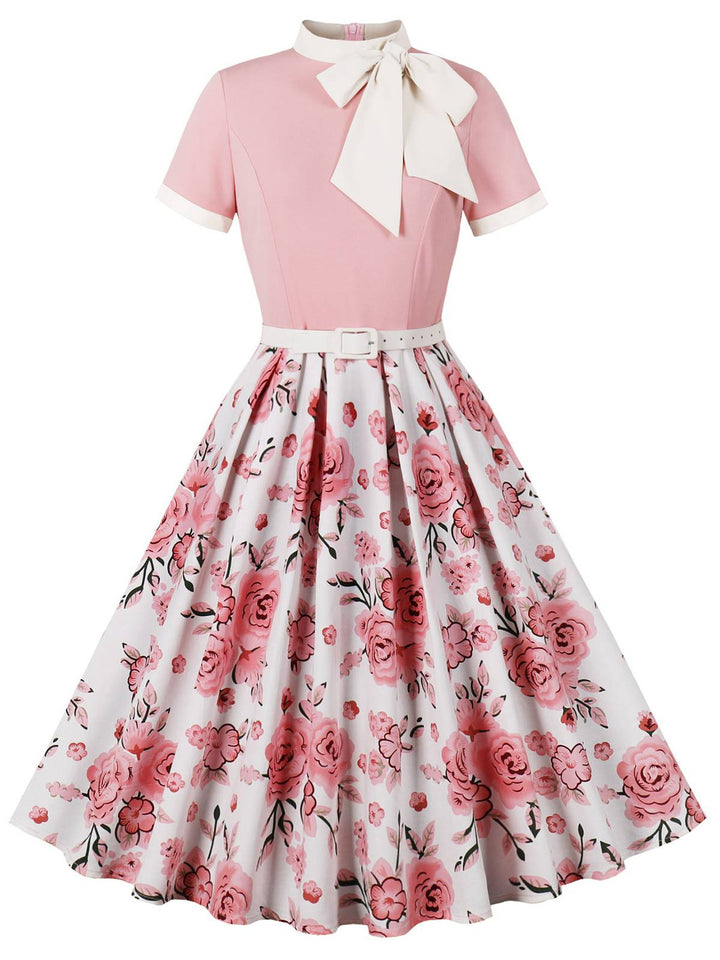 She slips into this Pink 1950s Rose Patchwork Tie Collar Dress and suddenly it&