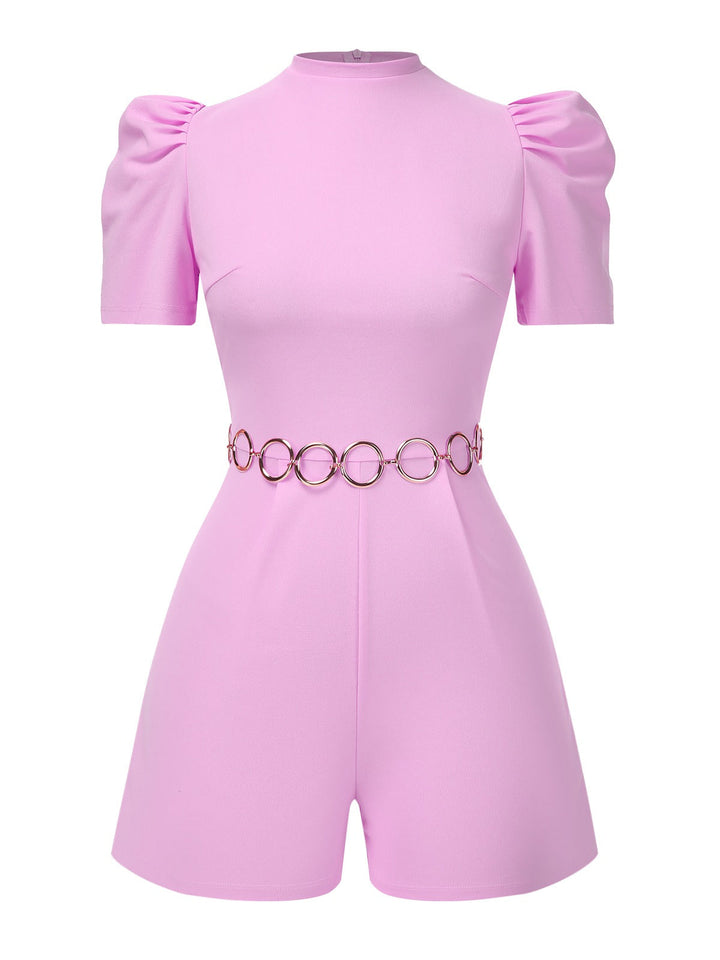 She adds this Pink 1950s Solid Puff Chain Belt Romper and suddenly it&