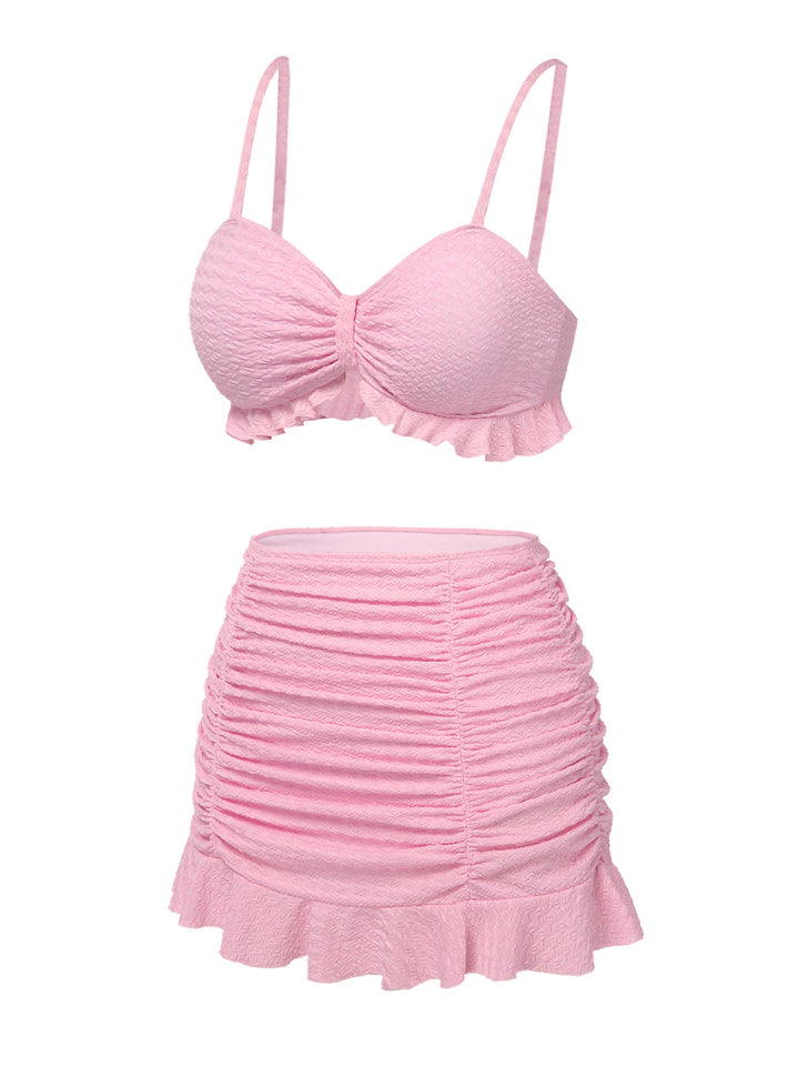 This Pink 1950s Spaghetti Strap Ruffle Solid Swimsuit carries 1950s vacation dreams in every stitch