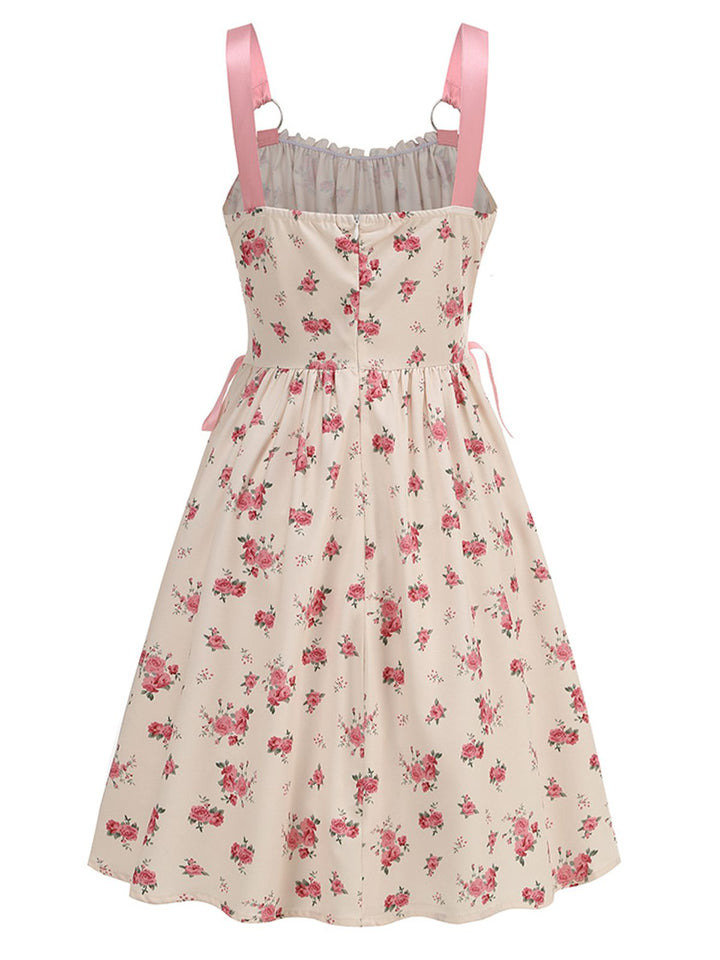 This Pink 1950s Strap Ditsy Floral Lace-Up A-Line Dress wraps her in 1950s elegance, one twirl at a time