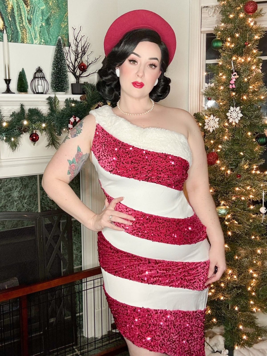 She slips into this Pink 1960s Candy Cane One-Shoulder Dress and suddenly it&