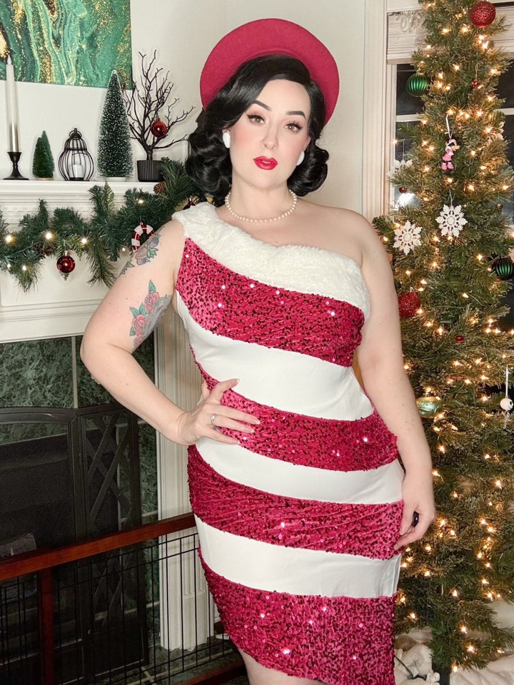 She slips into this Pink 1960s Candy Cane One-Shoulder Dress and suddenly it&