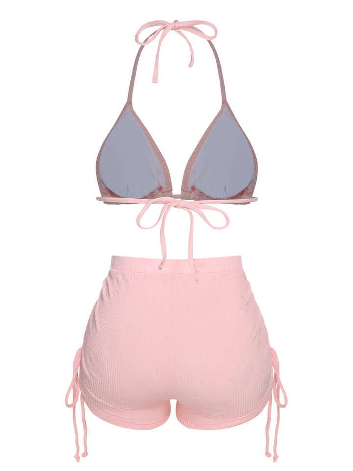 This Pink 1960s Floral Lace-Up Halter Swimsuit carries 1960s vacation dreams in every stitch