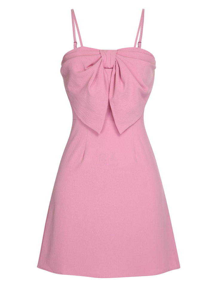 She slips into this Pink 1960s Solid Spaghetti Straps Bow Dress and suddenly it&