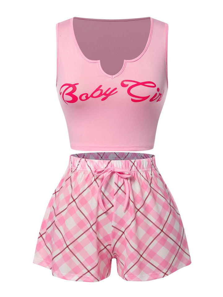 She pairs this Pink Baby Girl Tank Top &amp; Plaid Shorts Pajamas with confidence and charm