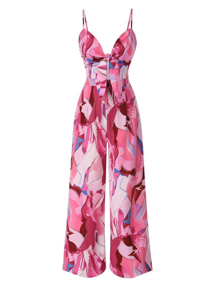 She finds her 1970s story in this Pink 1970s Strap Psychedelic Print Front-Tie Jumpsuit