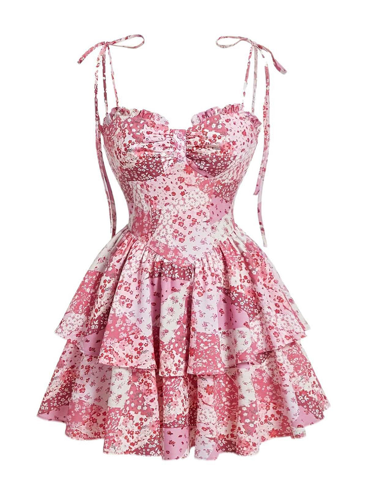 She slips into this Pink 1980s Spaghetti Strap Ditsy Floral Tiered Dress and suddenly it&