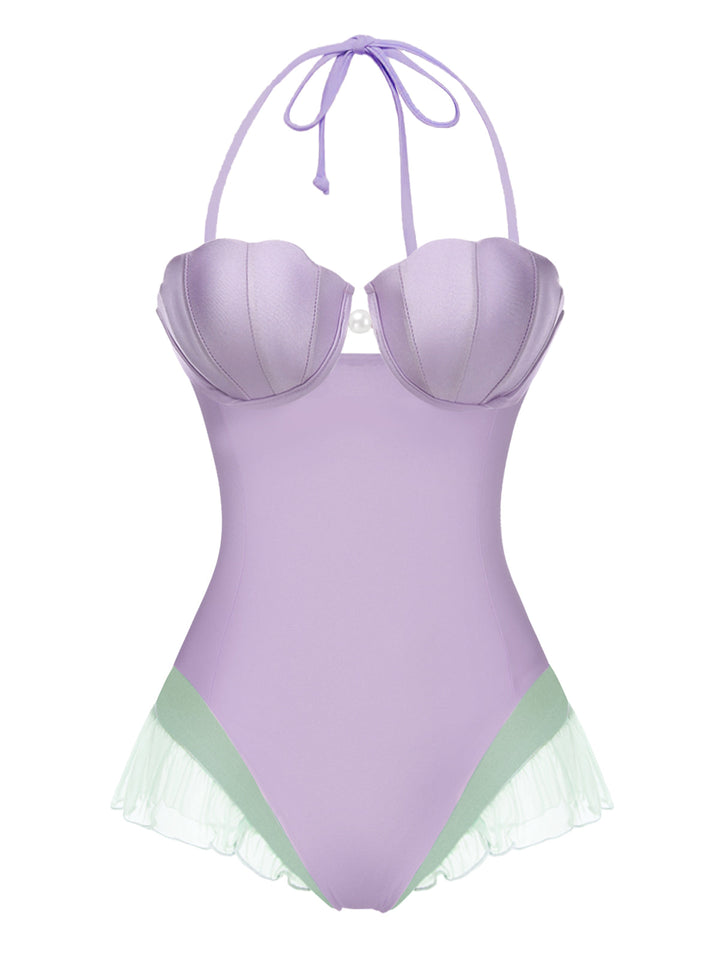 This Purple 1970s Shell Mermaid Bandeau One-Piece Swimsuit carries 1970s vacation dreams in every stitch