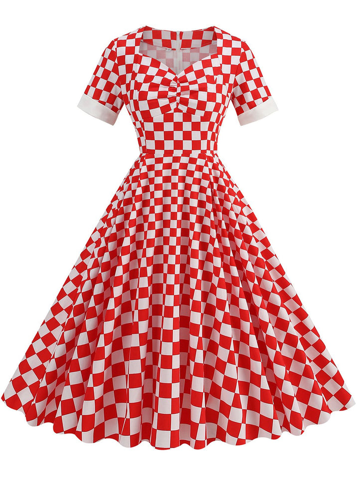 She slips into this Red 1950s Sweetheart Neck Plaids Dress and suddenly it&
