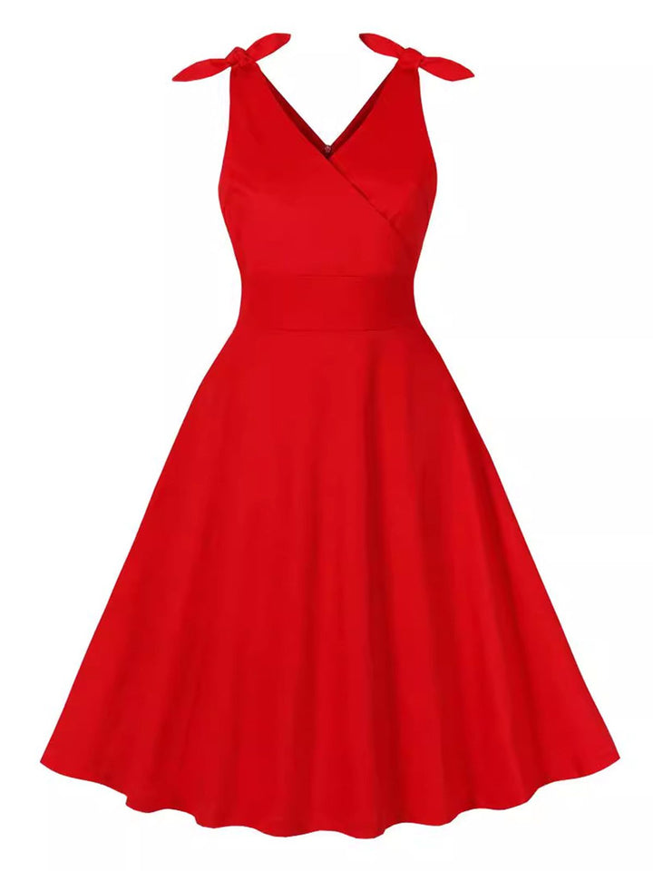 She slips into this Red 1950s V-Neck Sleeveless Solid Dress and suddenly it&