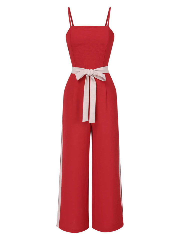 She adds this Red 1970s Spaghetti Strap Belted Stripe Jumpsuit and suddenly it&