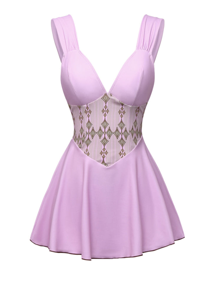She slips into this Rose Viole 1940s Wide-Straps Geometric Swimdress and suddenly it&