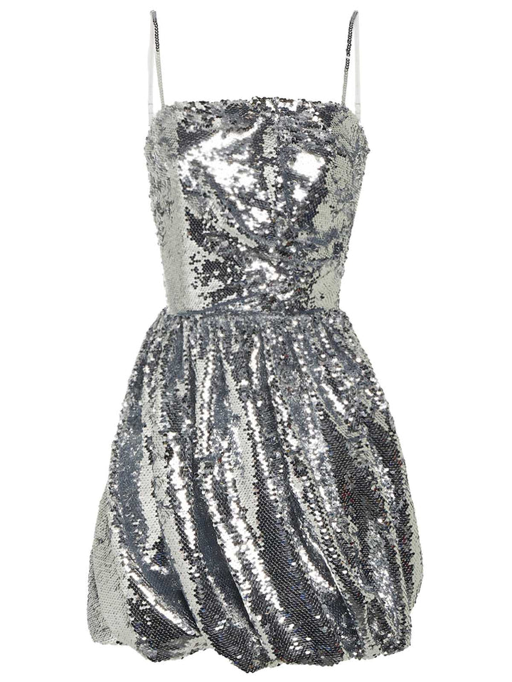 She slips into this Silver 1970s Spaghetti Straps Sequined Tutu Dress and suddenly it&