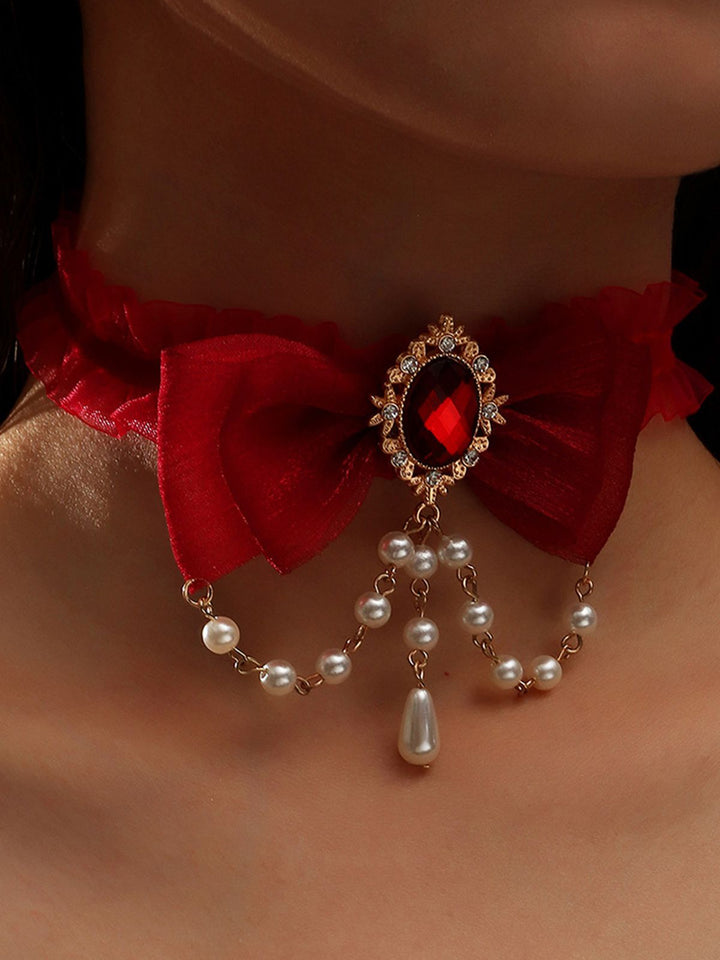 She adds this Vintage Bow Halloween Pearl Gemstone Necklace and suddenly it&