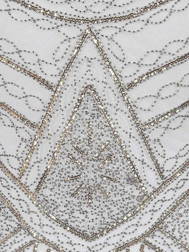 This White 1920s Fringed Flapper Dress wraps her in 1920s elegance, one twirl at a time