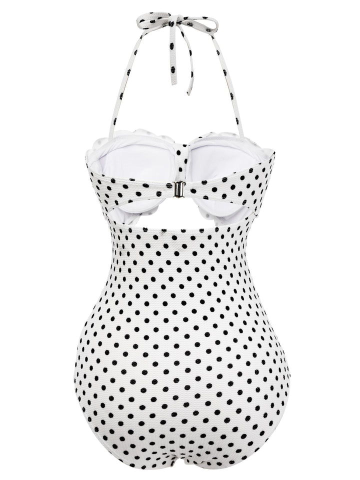 This White 1940s Polka Dot Lace Up Halter Swimsuit carries 1940s vacation dreams in every stitch