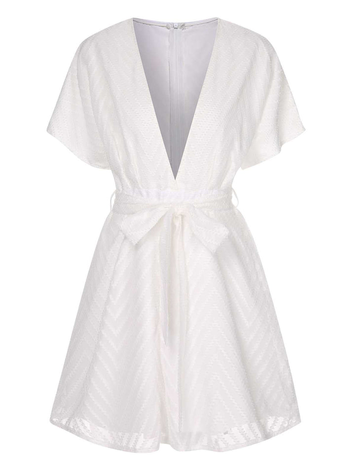 She adds this White 1950s Deep V-Neck Textured Belted Romper and suddenly it&