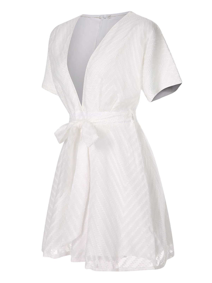 This White 1950s Deep V-Neck Textured Belted Romper carries 1950s stories waiting to be told