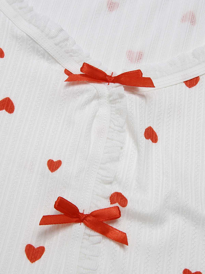 This White Curled Heart Bow Long Sleeve Pajamas whispers secrets to those who notice