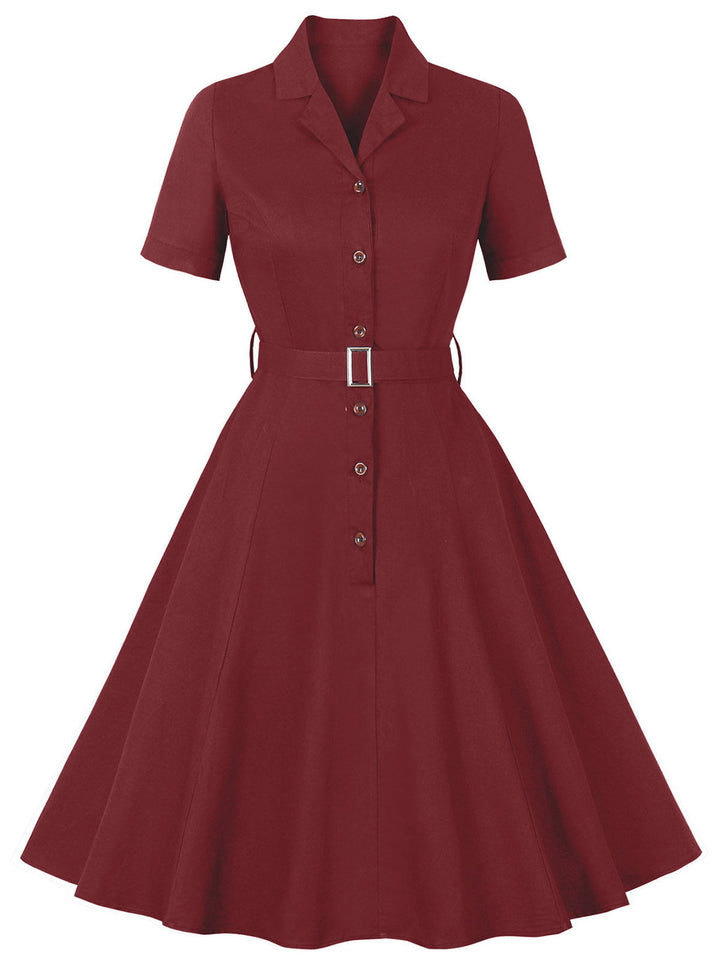 She slips into this Wine Red 1950s Solid Lapel Belted Dress and suddenly it&