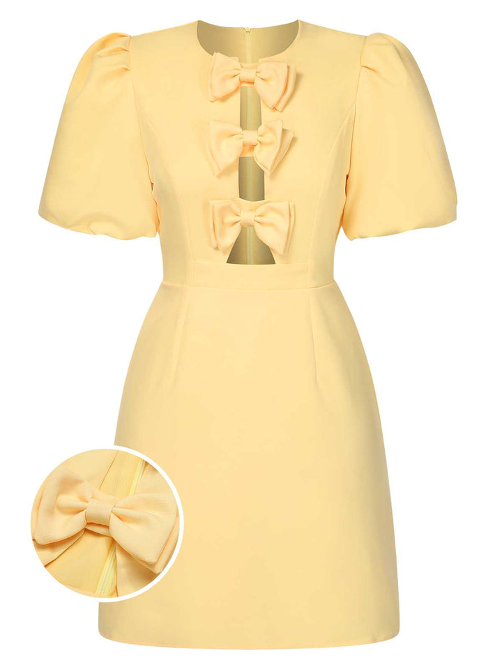 She slips into this Yellow 1960s Bow Puff Sleeve Solid Dress and suddenly it&