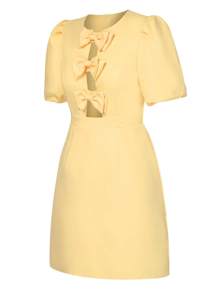Yellow 1960s Bow Puff Sleeve Solid Dress — the kind of 1960s dress that makes strangers smile